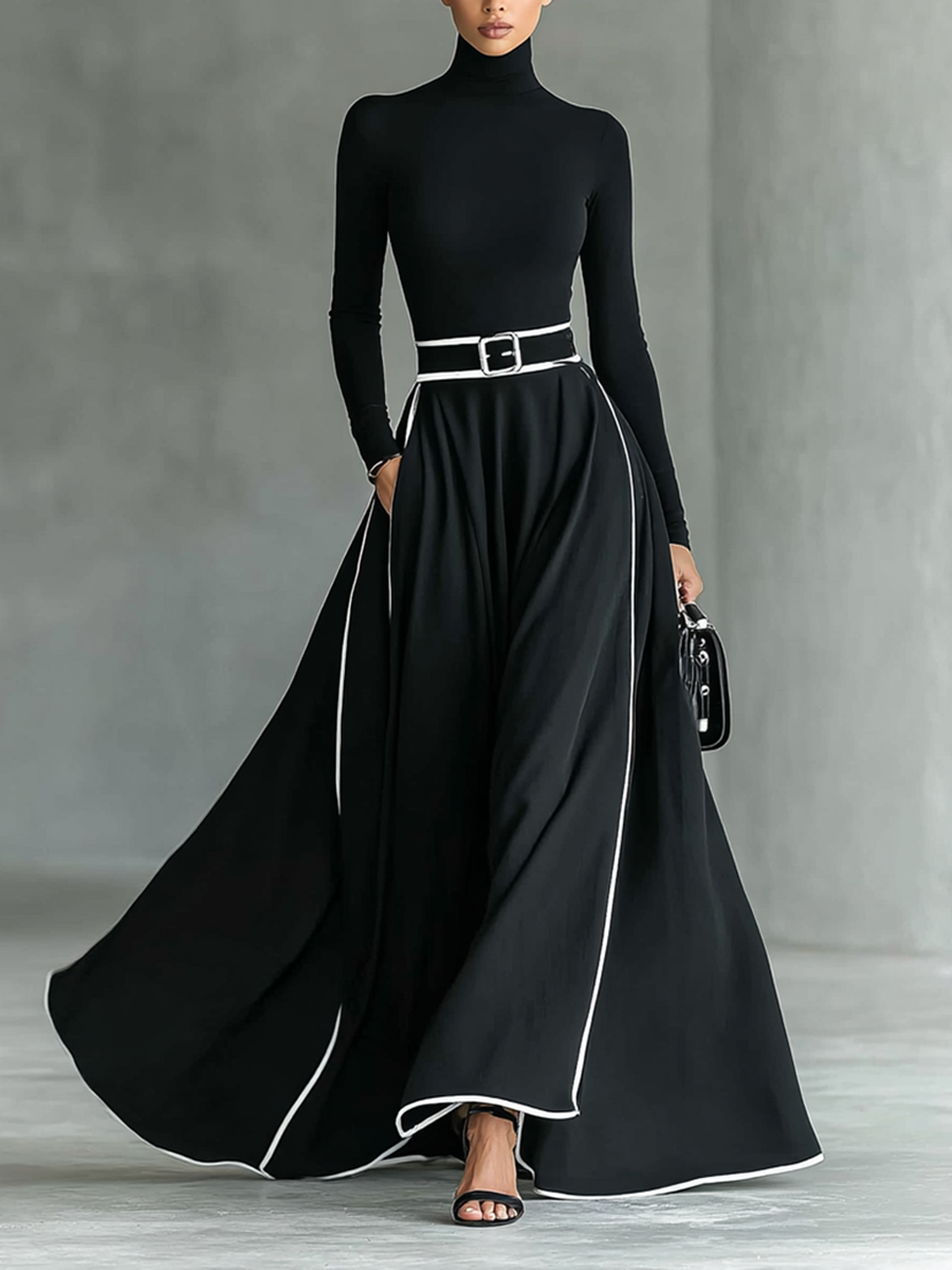 Gina – Vestido largo de mujer negro con costuras blancas, cuello alto, mangas largas y cintura estrecha