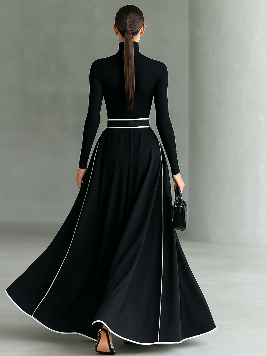 Gina – Vestido largo de mujer negro con costuras blancas, cuello alto, mangas largas y cintura estrecha